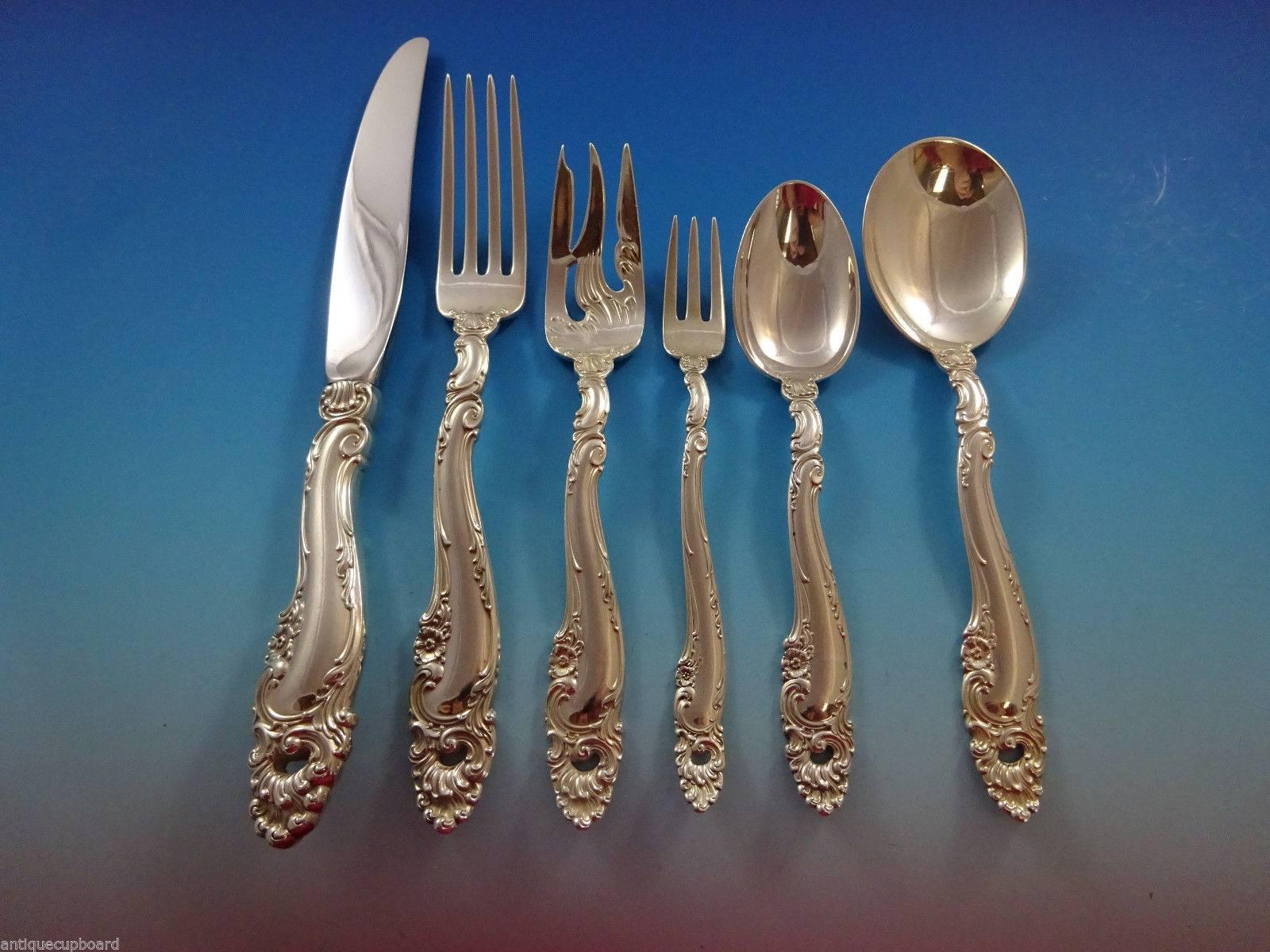 Decor by Gorham sterling silver flatware set of 60 pieces. This pattern is heavy and features Rococo swirls, shells and small flowers. This set includes:

Eight knives, 9