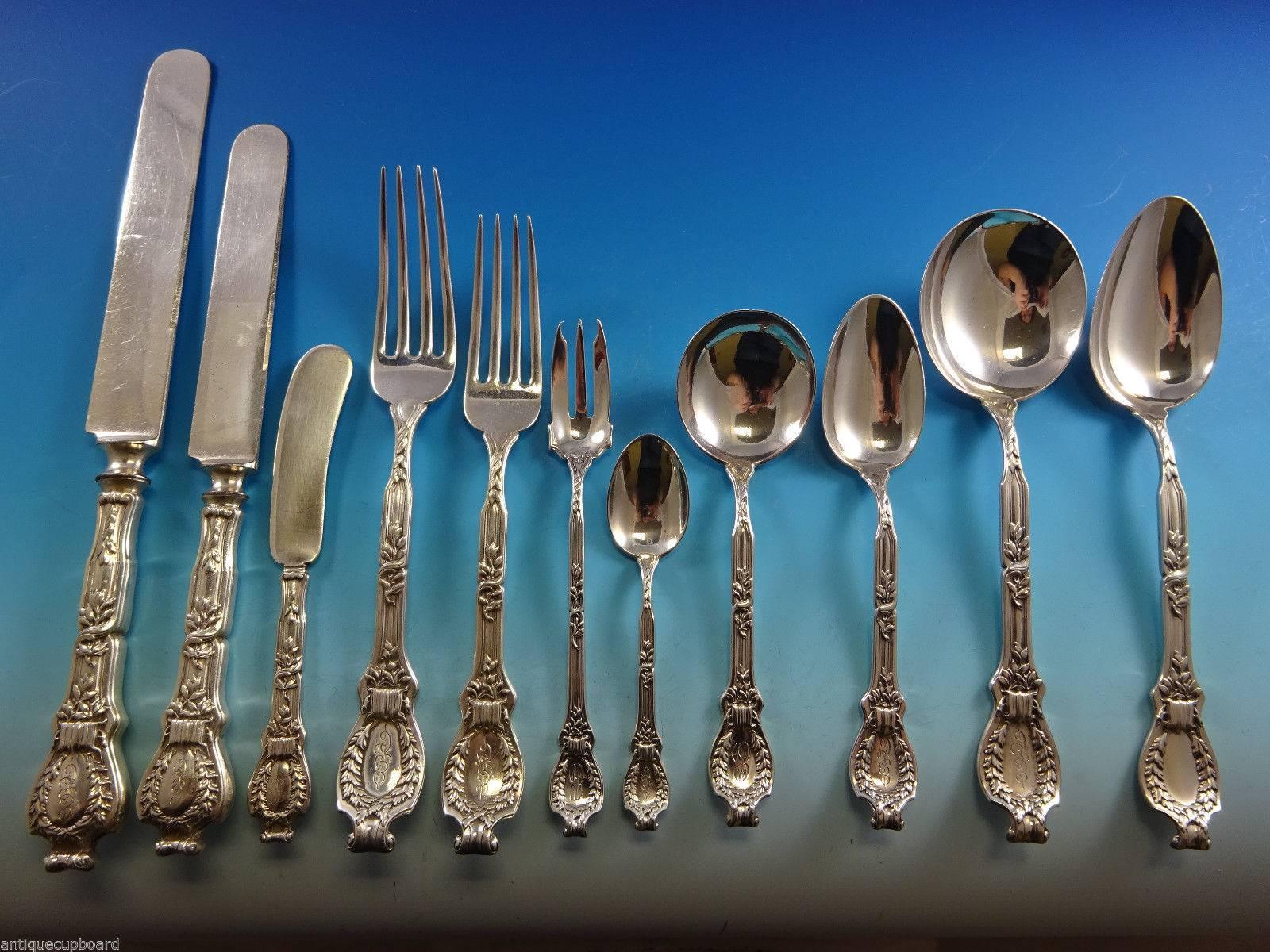 Monumental Du Barry Dubarry sterling silver flatware set of 133 pieces. This pattern was issued by Durgin in the year 1901 and features a wreath motif with elegant, shaped handle. This set includes:

12 dinner size knives, 10