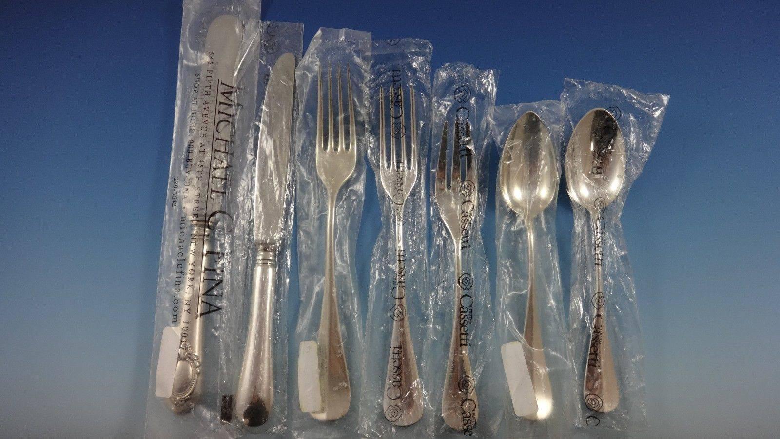Beautiful Medallion by Cassetti sterling silver flatware set of 43 pieces. This pattern features a plain front and a medallion on the reverse. The pieces are large and heavy. This set includes:

Five dinner size knives, 10