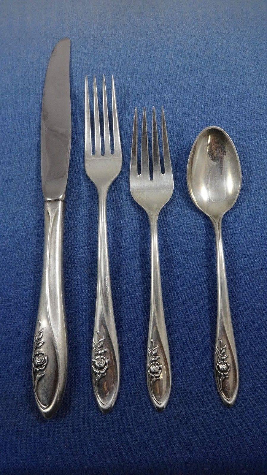 Lovely sculptured rose by Towle sterling silver flatware set of 67 pieces. This set includes:

12 knives, 9 1/8