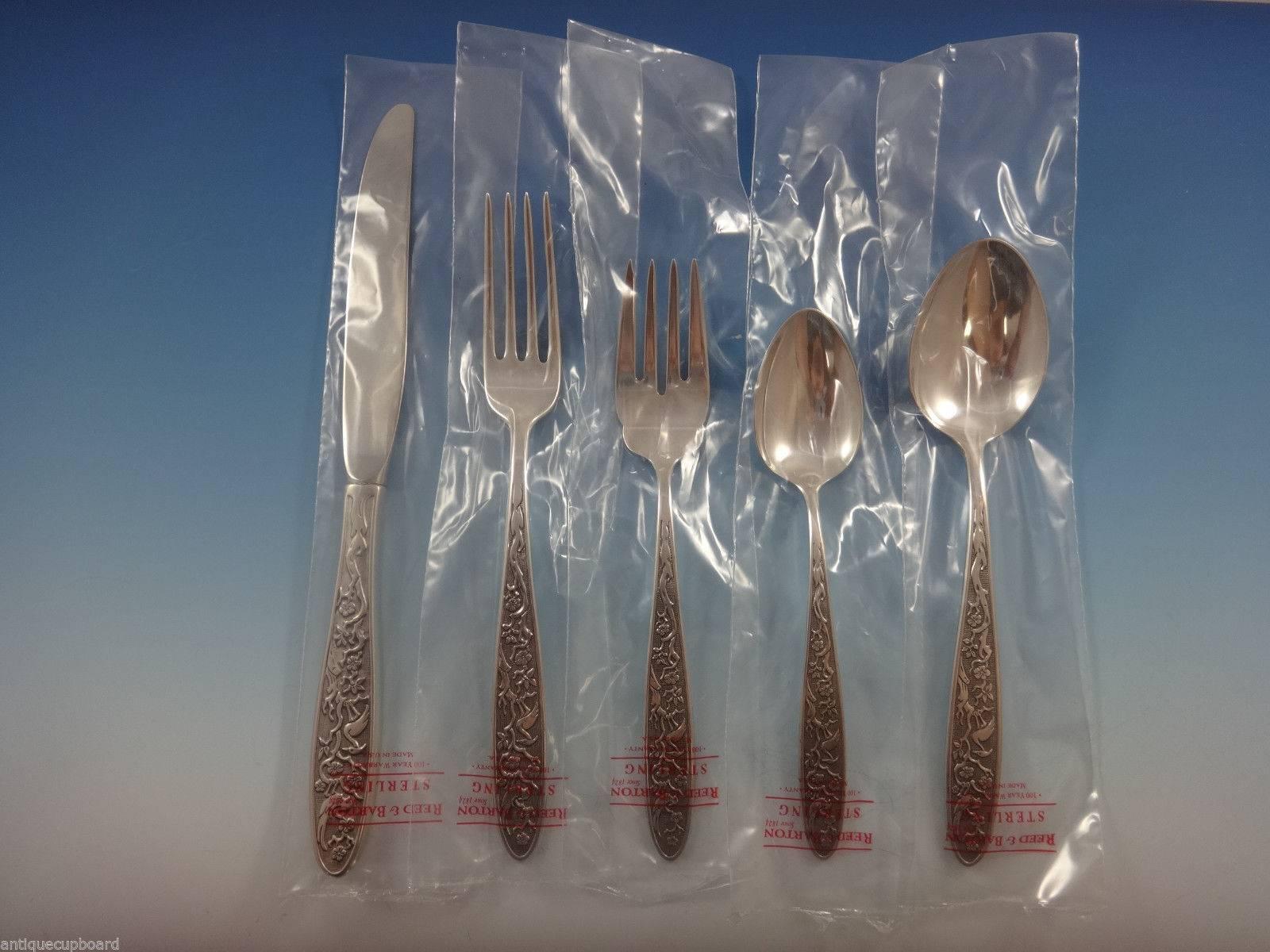 Rare Tree of Life by Reed & Barton sterling silver flatware set of 64 pieces. This pattern features a Japanese cherry blossom tree with birds against a matte background. Unique and beautiful Japanesque motif! This set includes:

12 knives, 9