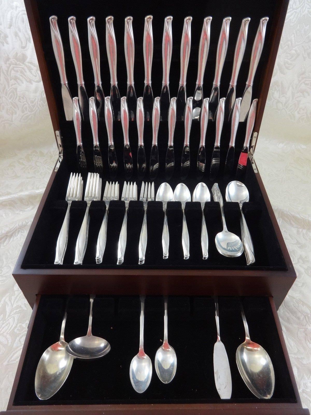 Beautiful spring bud by Alvin sterling silver flatware set for 12 - 88 pieces. This set has a great flowing modern design! This set includes:

12 knives, 9