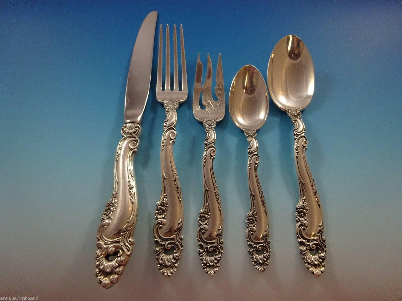Monumental dinner size decor by Gorham sterling silver Flatware set - 141 Pieces. This pattern is heavy and features rococo swirls, shells, and small flowers. This set includes: 
12 dinner knives, 9 5/8