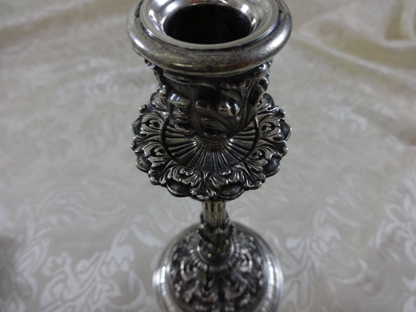 Grande Imperiale by Buccellati
Italy - Italian.

Grande Imperiale by Buccellati beautiful vintage sterling silver pair of hand chased candlesticks with fabulous detail. Height is 9 1/8", weight 20 troy ounces each, (total 40 ozt). Excellent