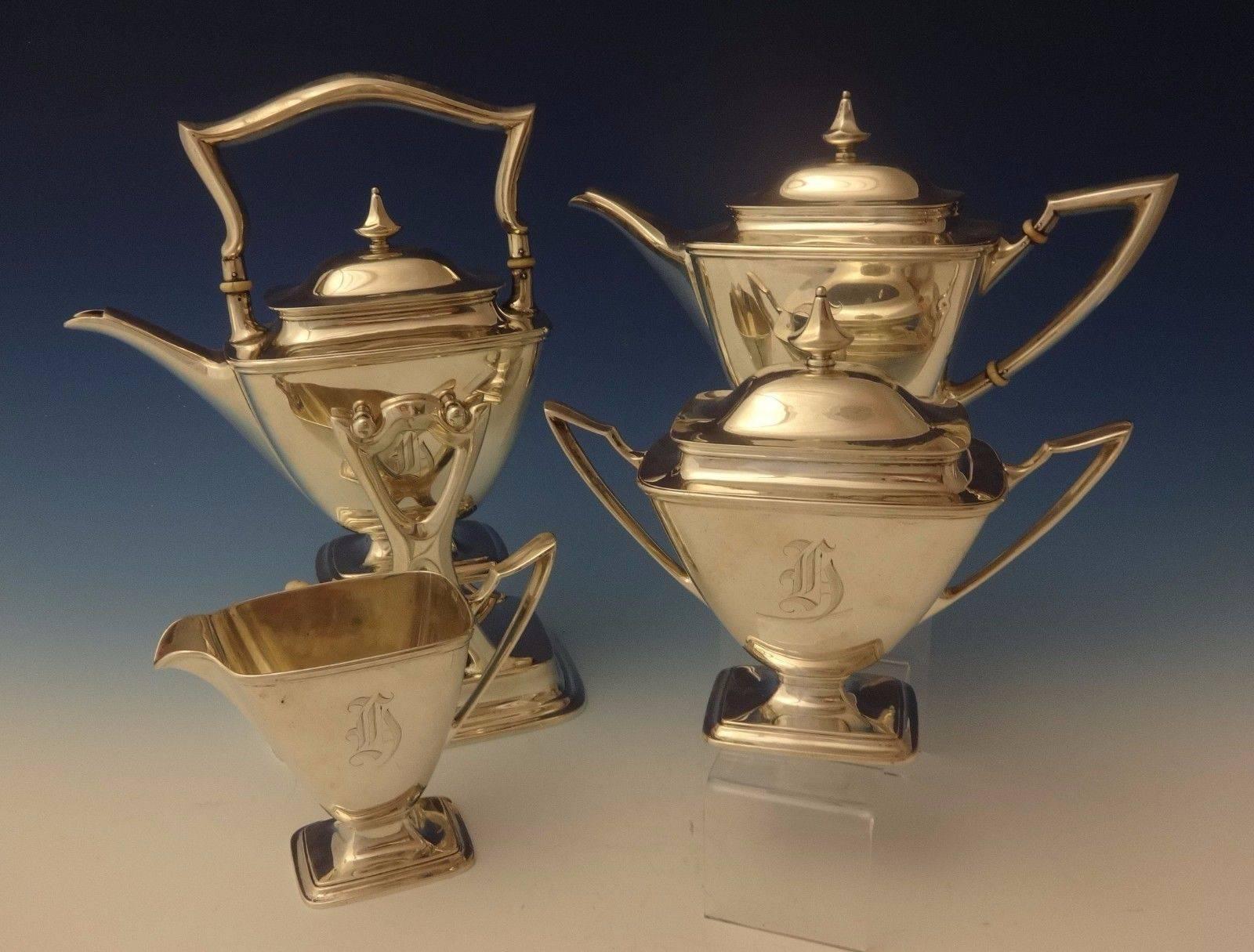 Mary Chilton by Towle. 

Mary Chilton by Towle four-piece sterling silver tea set. This Classic looking set includes a three-piece tea set and a hot water kettle, circa 1920. They are marked with #7669 and the pieces have an 