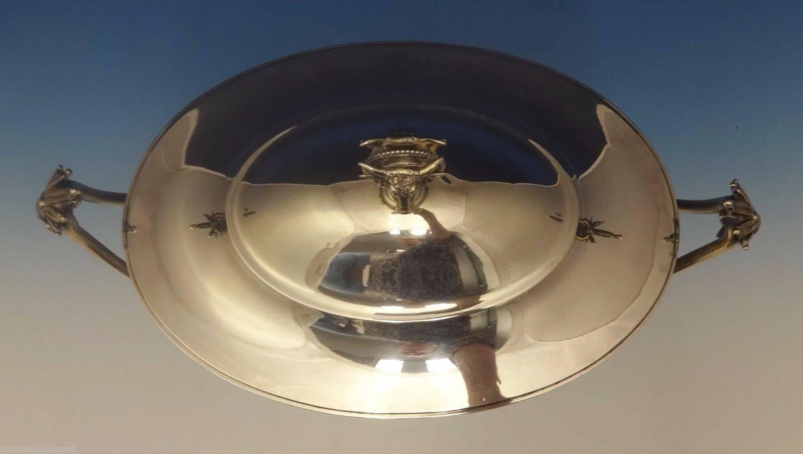 Gorham.

Gorham sterling silver covered tureen featuring a 3-D bull on either side of the finial. There are also applied ornate handles with figural lions. The piece is marked #150 with date letter E for 1872. It will hold 6 1/2 pints. It measures 8