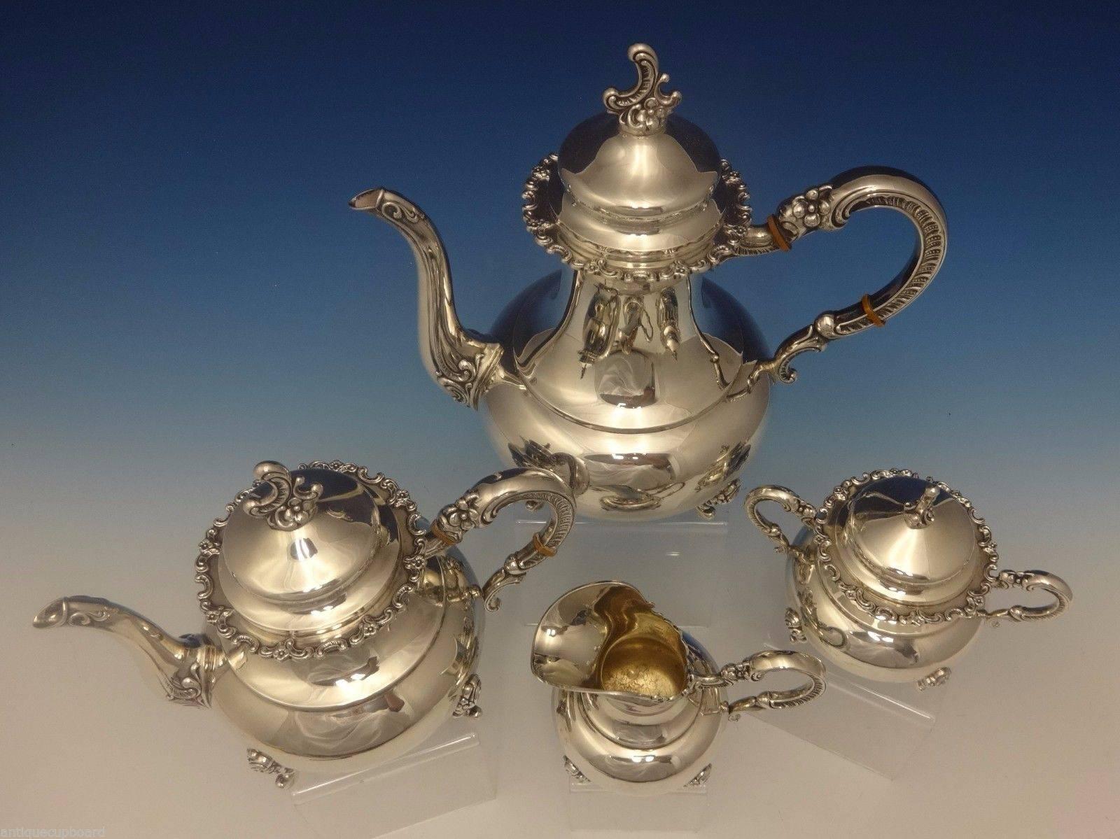 Heidelberg.

Heidelberg of Germany sterling silver four-piece tea set. It features applied Rococo swirls and flowers on the rim, feet, handles, and finials. The set includes:

Coffee pot: Measures 11