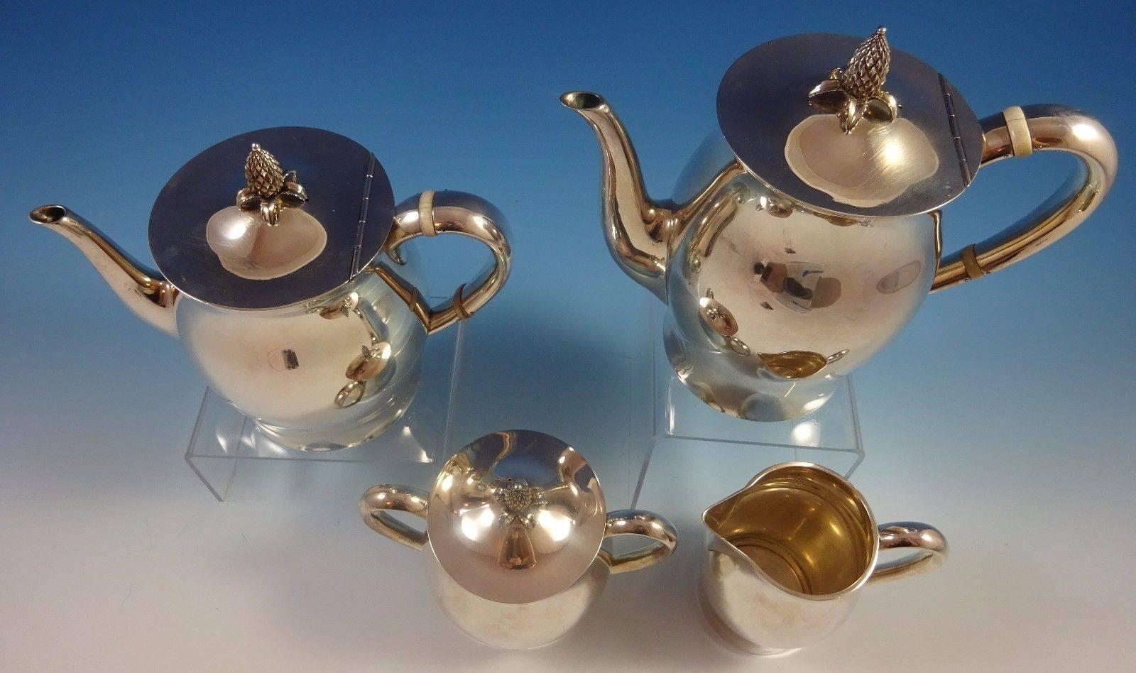 Paul revere by Tuttle sterling silver four-piece tea set #390. Made in Harry Truman's first term 1945-1949. This set includes:

One tea pot: weighs 19.25 ozt., and it measures 7" x 7 1/2". 

One coffee pot: weighs 20.67 ozt., and it