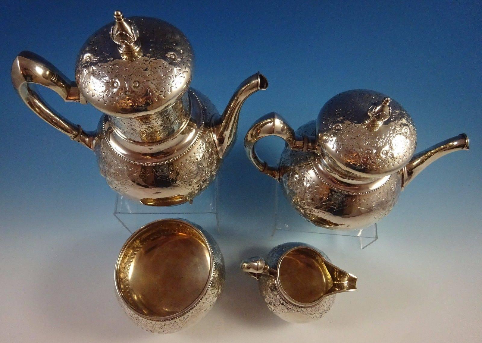 Whiting.

Beautiful whiting sterling silver four-piece tea set. It features repoussed flowers and hand engraved detail. All pieces are marked with an 