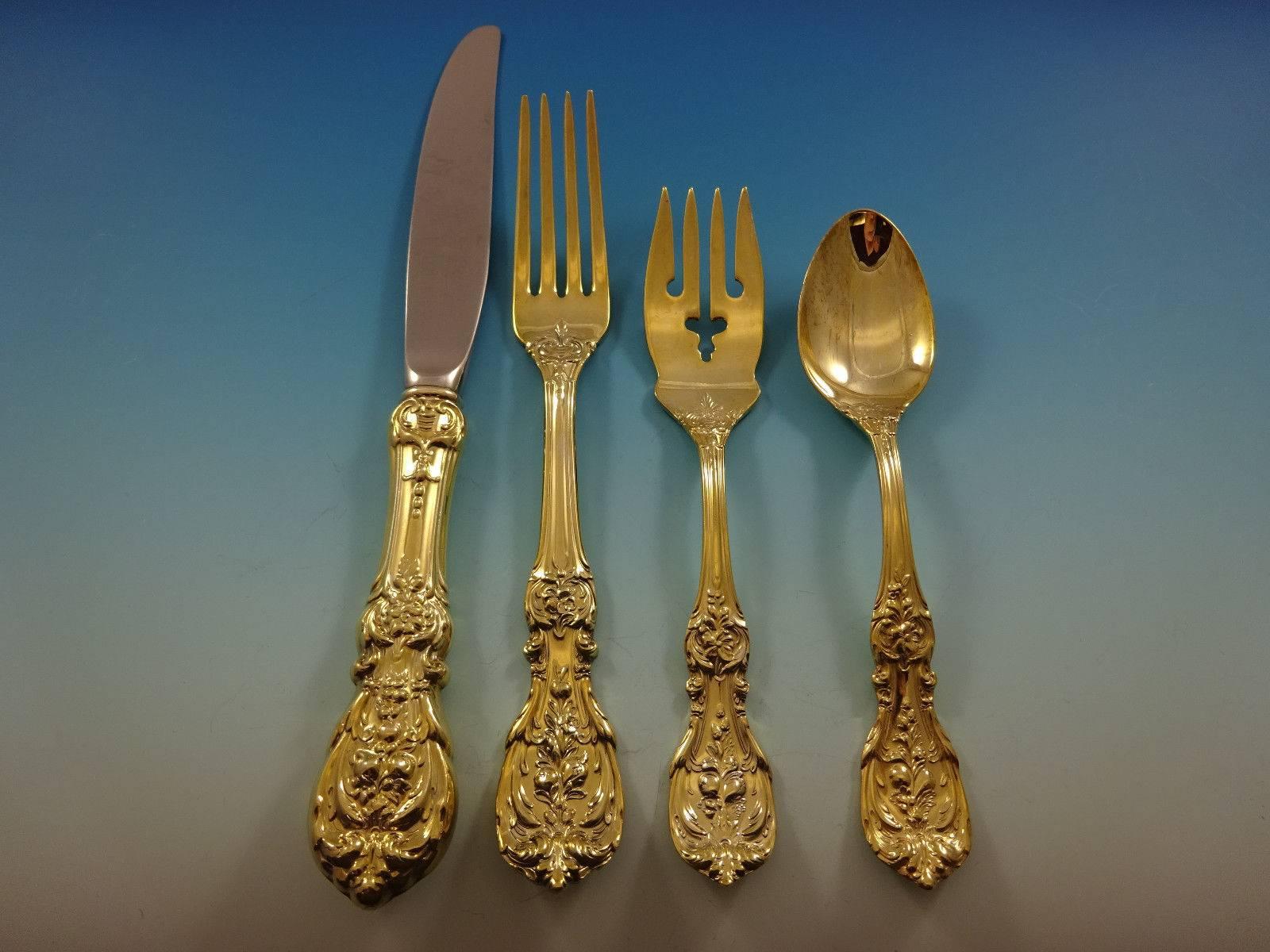 Francis I (newer mark) gold by Reed and Barton. 

Sterling silver flatware set of 48 pieces. Gold flatware is on trend and makes a bold statement on your table, especially when paired with gold rimmed china and gold accents. This set is vermeil