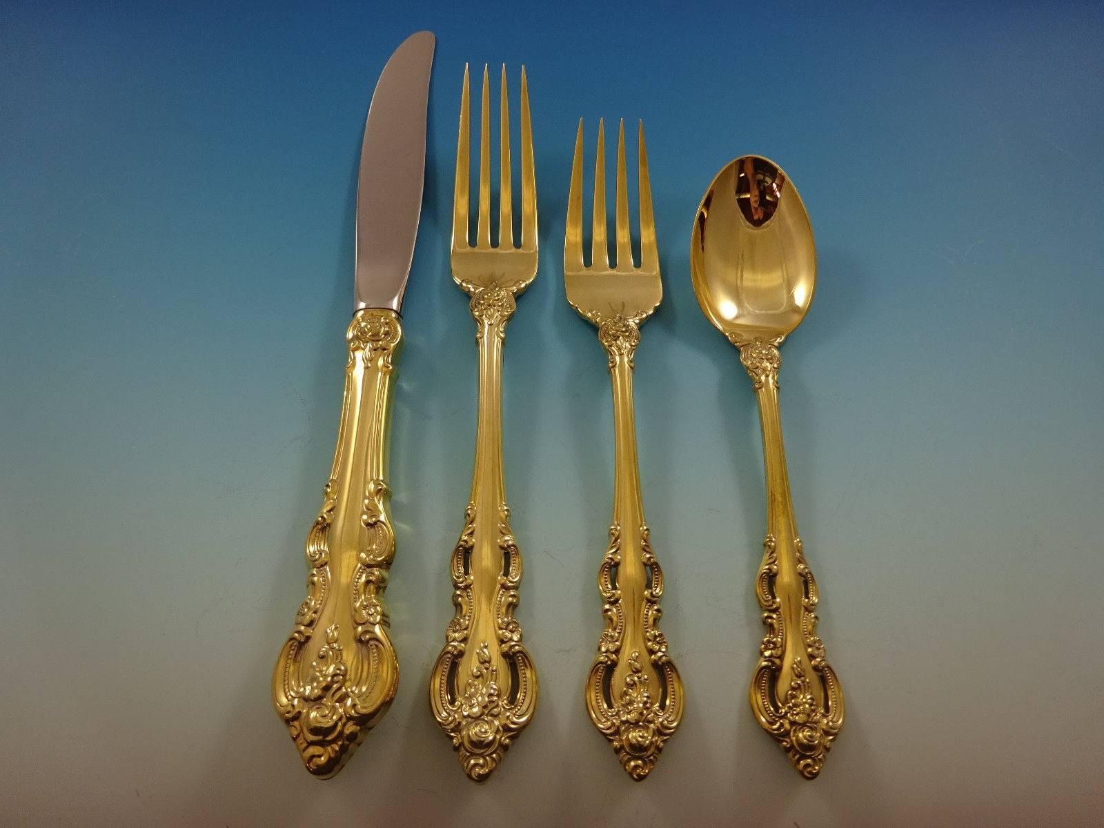 El Grandee Gold by Towle Sterling Silver flatware set - 48 pieces. 

Gold flatware is on trend and makes a bold statement on your table, especially when paired with gold rimmed china and gold accents. This set is vermeil (completely gold-washed) and
