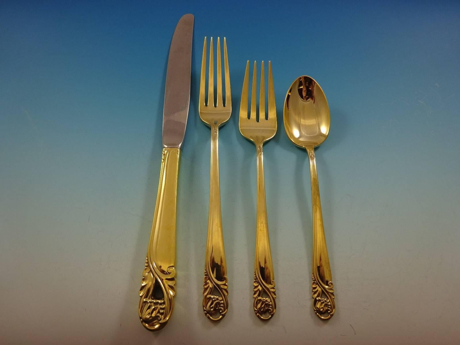 Gorgeous Spring Glory Gold by International sterling silver flatware set of 48 pieces. Gold flatware is on trend and makes a bold statement on your table. 

This set is vermeil (completely gold-washed) and includes:

12 knives, 9 1/4
