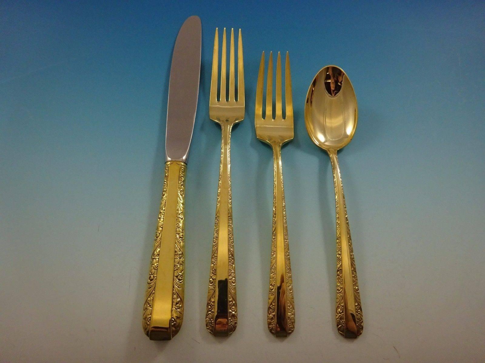 Candlelight Gold by Towle sterling silver flatware set of 48 pieces. Gold flatware is on trend and makes a bold statement on your table. 

This set is vermeil (completely gold-washed) and includes:

12 knives, 8 1/2