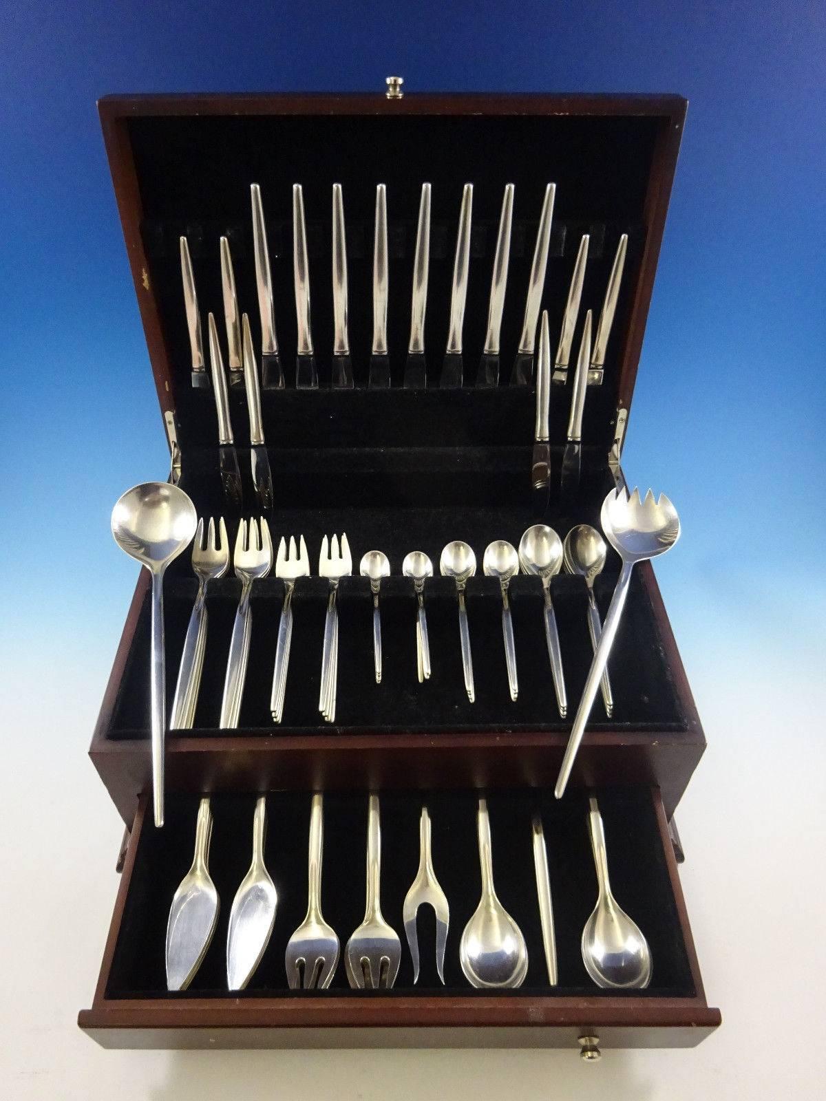 Unadorned Scandinavian Modern Tulip by A. Michelsen sterling silver Flatware set, 83 pieces. 

This set includes:

Eight knives, 8 1/2