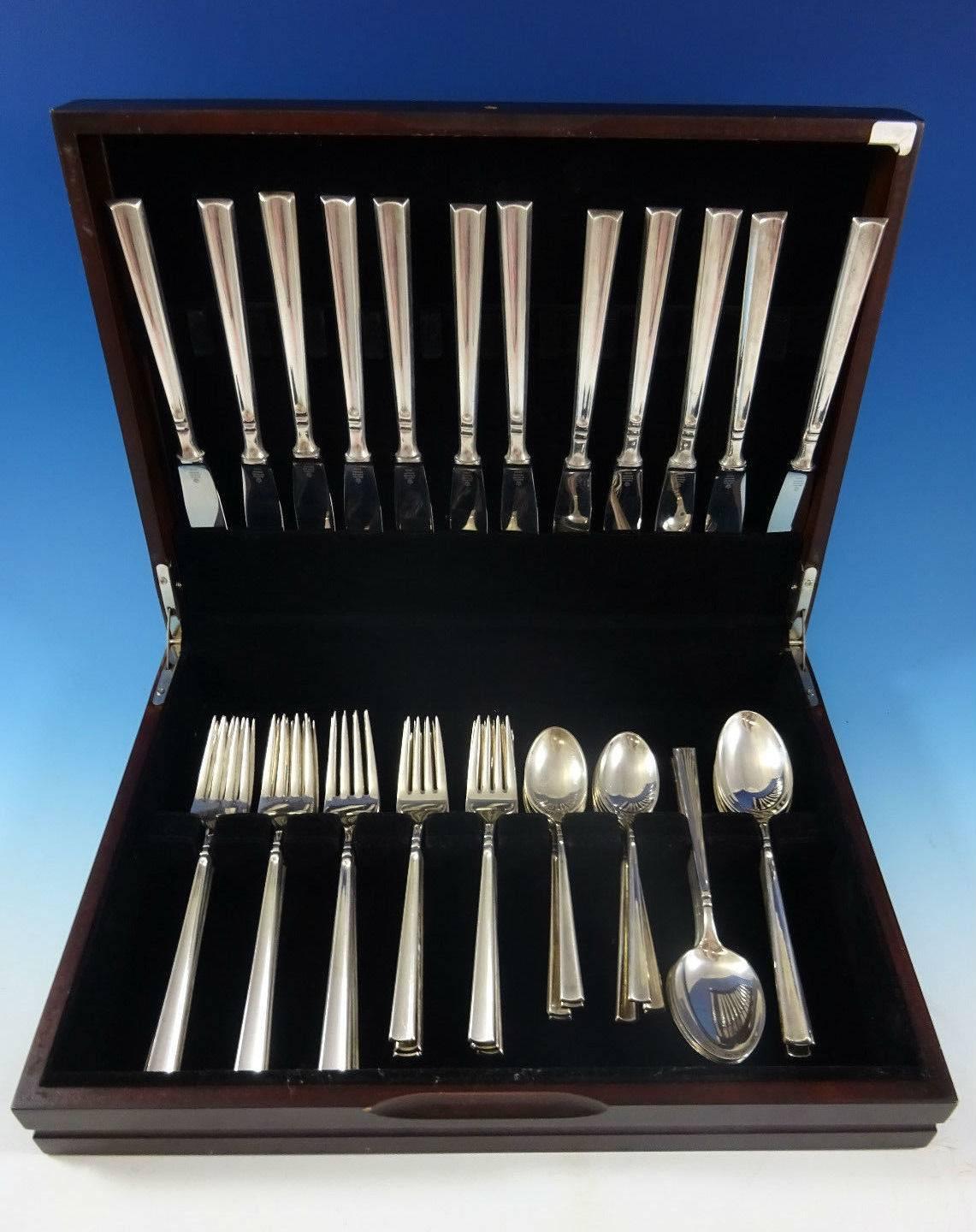 Rare Mexican Art Deco by Codan (Mexico City) sterling silver flatware set - 60 Pieces. 

This set includes:

12 dinner knives, 9 1/8