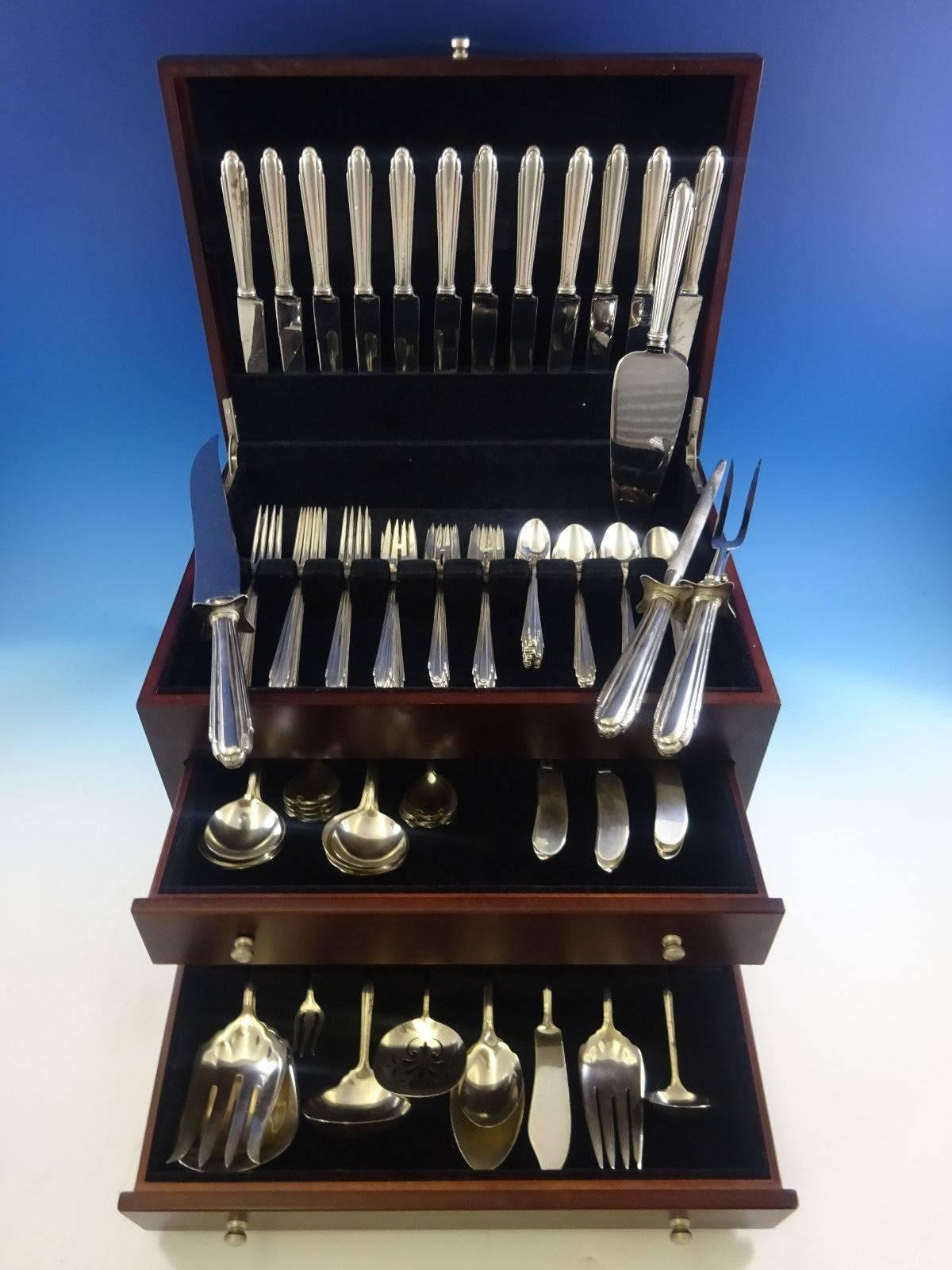 12 knives, 8 1/2", 12 forks, 7 1/4", 12 salad forks, 6 3/4", 12 teaspoons, 6", 12 cream soup spoons, 6", 12 flat handle butter spreaders, 6 5/8", 12 ice cream forks, 5 1/4", 12 demitasse spoons, 4 3/8", one