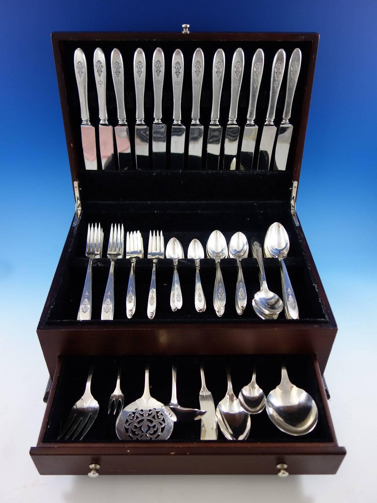 12 dinner knives, 8 1/2".
12 dinner forks, 7 1/4".
12 salad forks, 6 1/2".
12 teaspoons, 6".
12 place soup spoons, 7 1/4".
12 coffee spoons, 5".
One gravy ladle, 6 7/8".
One serving spoon, 8