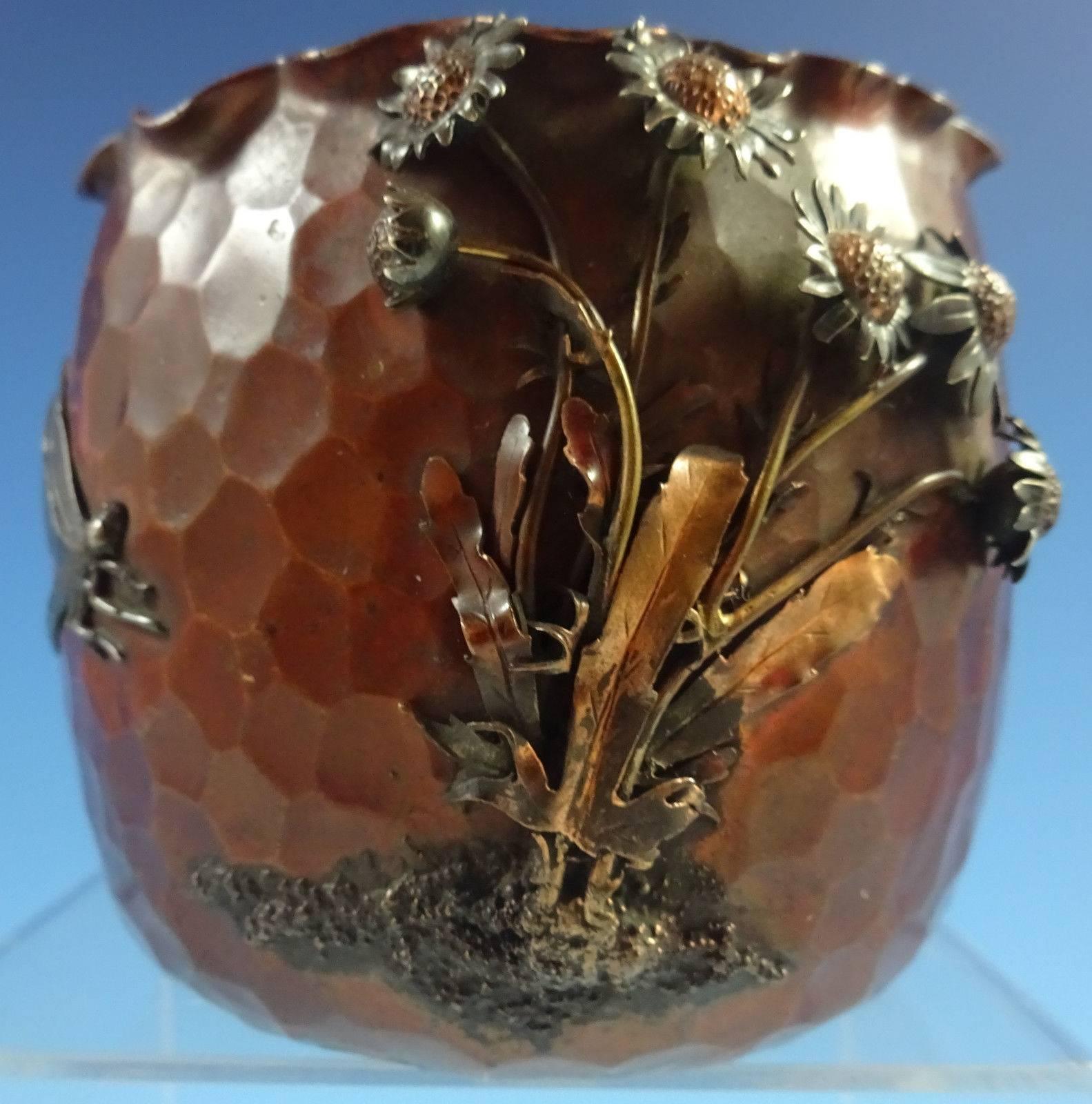 Stunning Gorham mixed metals vase made with sterling silver applied on copper. The piece has a silver dragonfly and applied copper, silver, and gold 3-D flowers. The vase dates from 1880, and it measures 3 1/2" x 3 3/4".

This piece is not