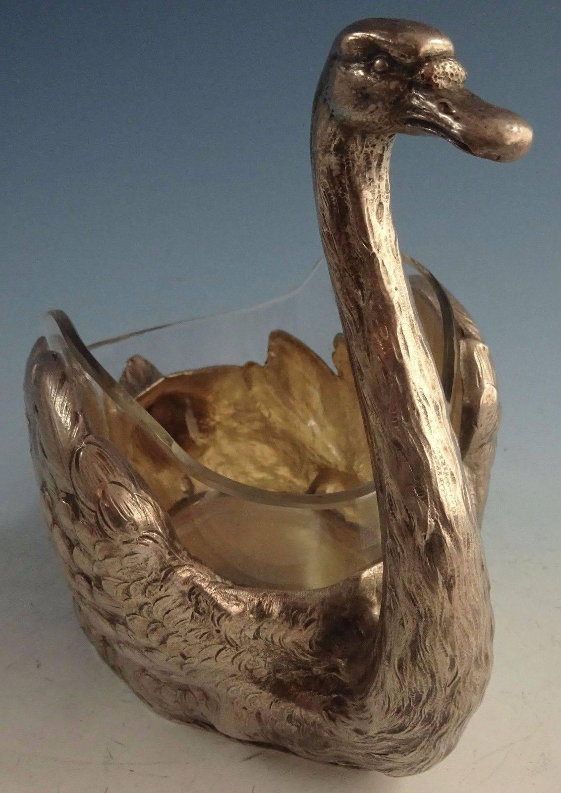 German 800 silver swan centrepiece with a glass insert. It measures 6 1/2