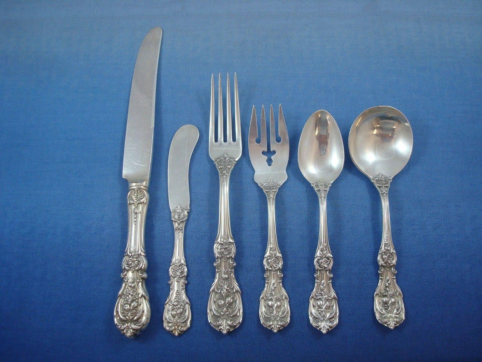12 knives (silver-plated blades) 9 1/4
