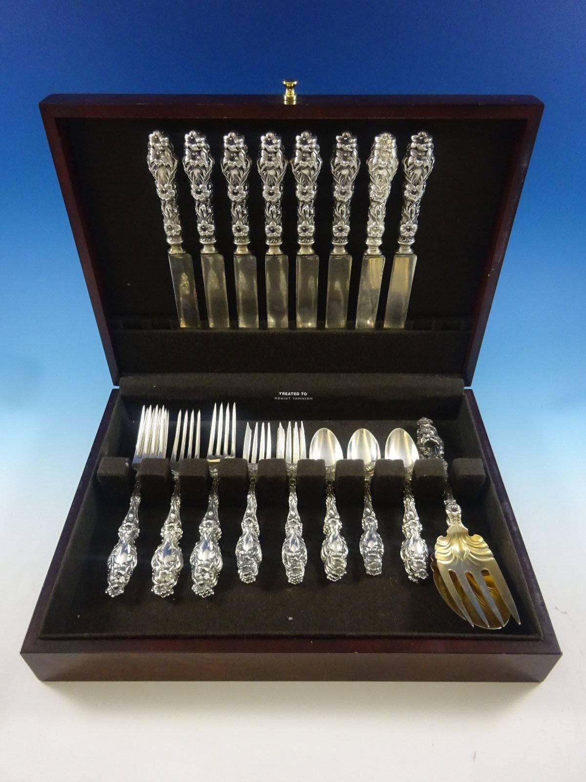 Lily by Whiting sterling silver dinner size flatware set of 34 pieces. This set includes: 

eight dinner size knives, wide early hand-cast handles and blunt silver-plated blades, 9 5/8