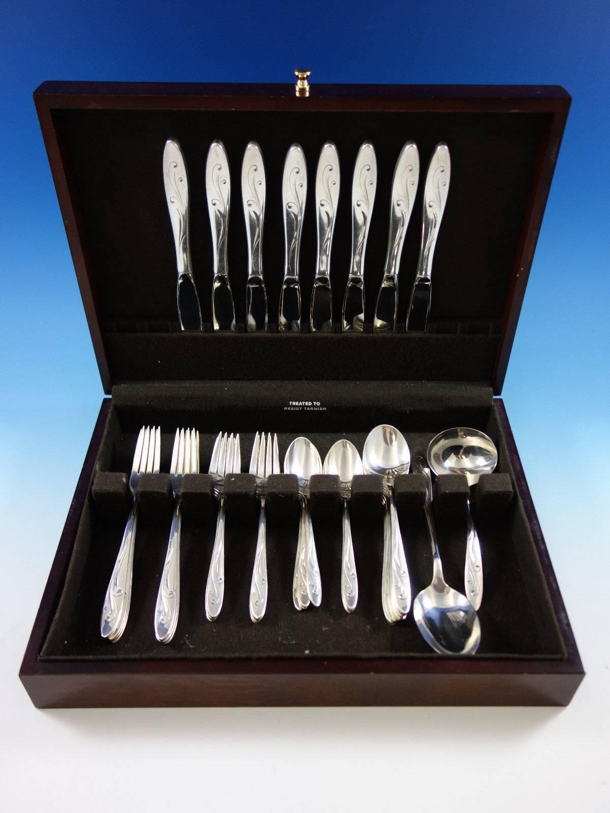 Awakening by Towle sterling silver flatware set of 42 pieces. This set includes: 
Eight knives, 8 3/4