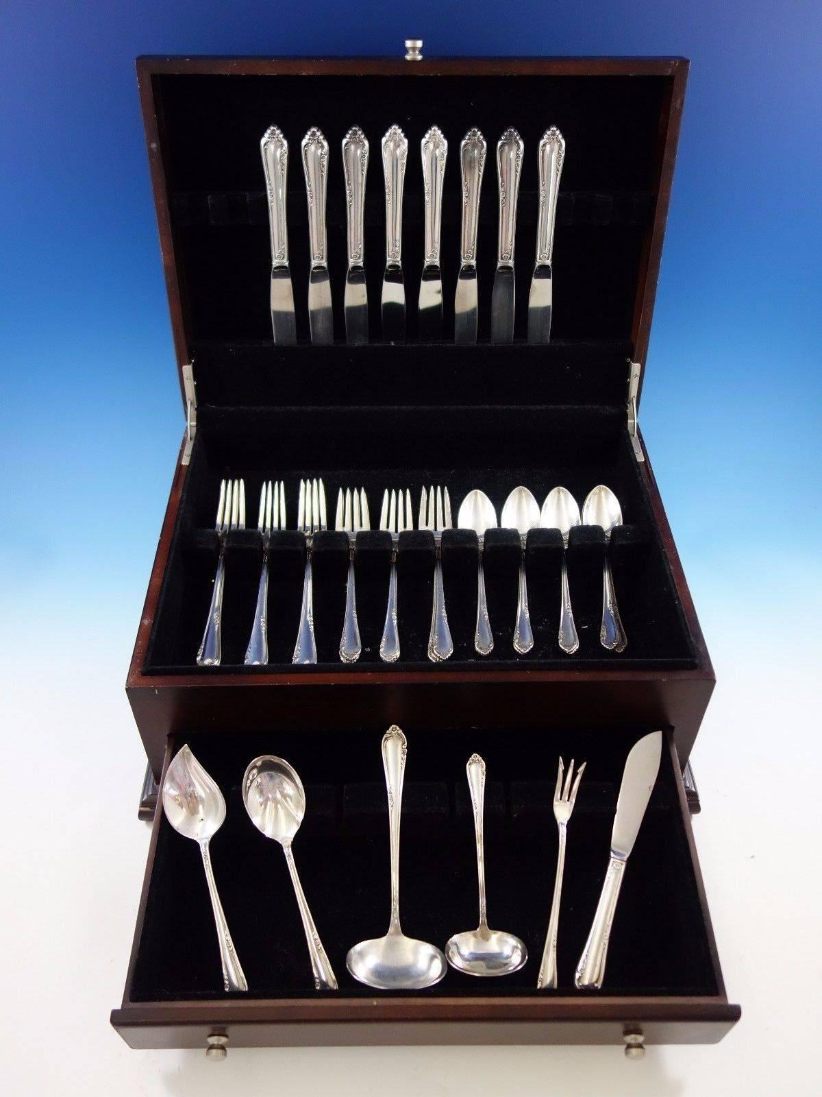 Dancing flowers by Reed & Barton sterling silver flatware set - 38 pieces. This set includes: 

Eight knives, 8 7/8