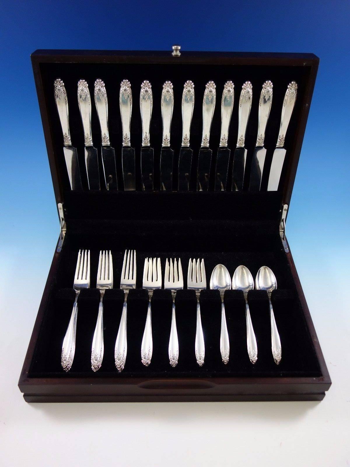 Prelude by international sterling silver flatware set 48 pieces. This set includes: 
12 knives, 9 1/8