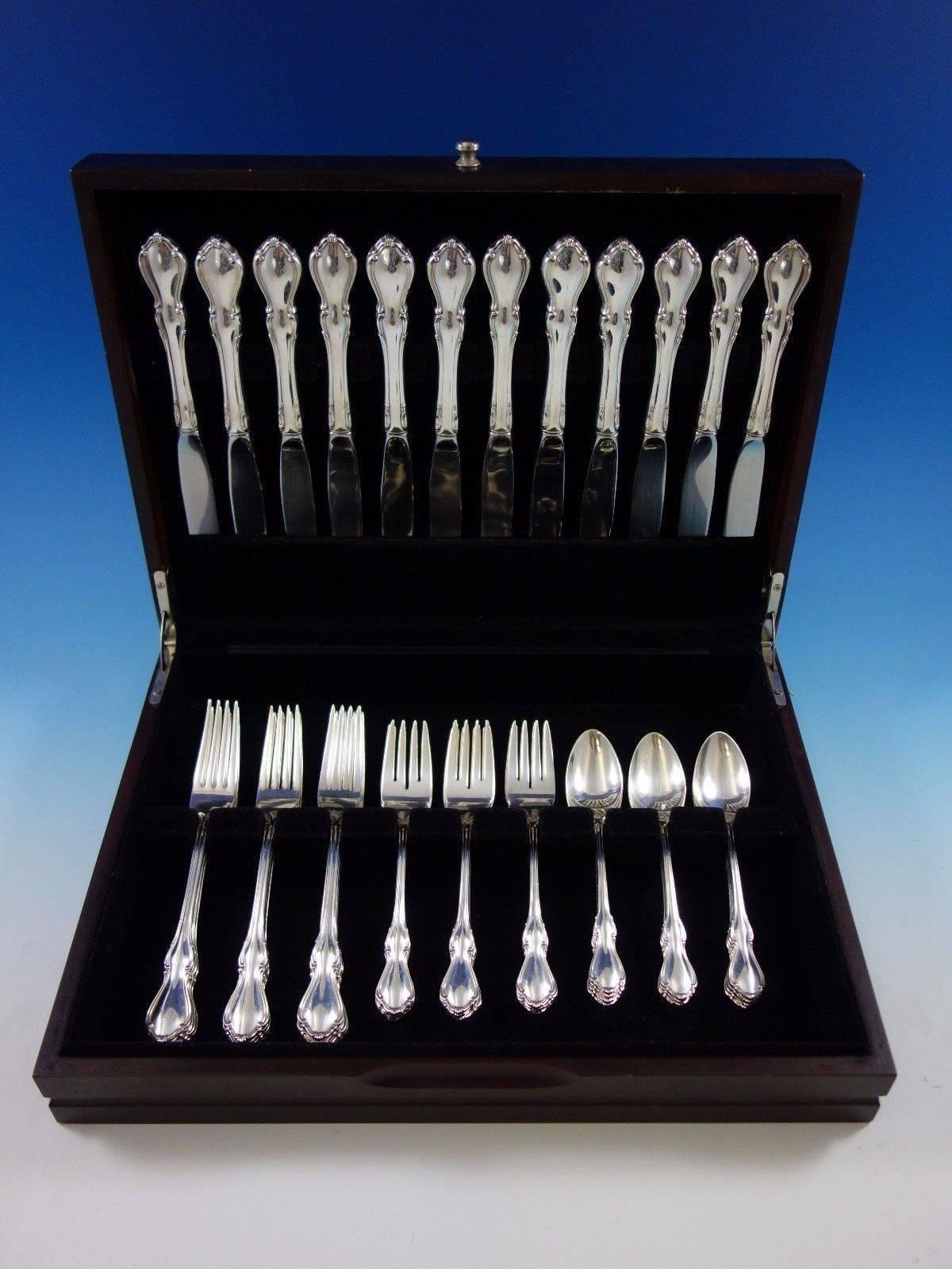 Stunning Hampton Court by Reed & Barton sterling silver flatware set, 48 pieces. This set includes: 

12 knives, 9 1/8