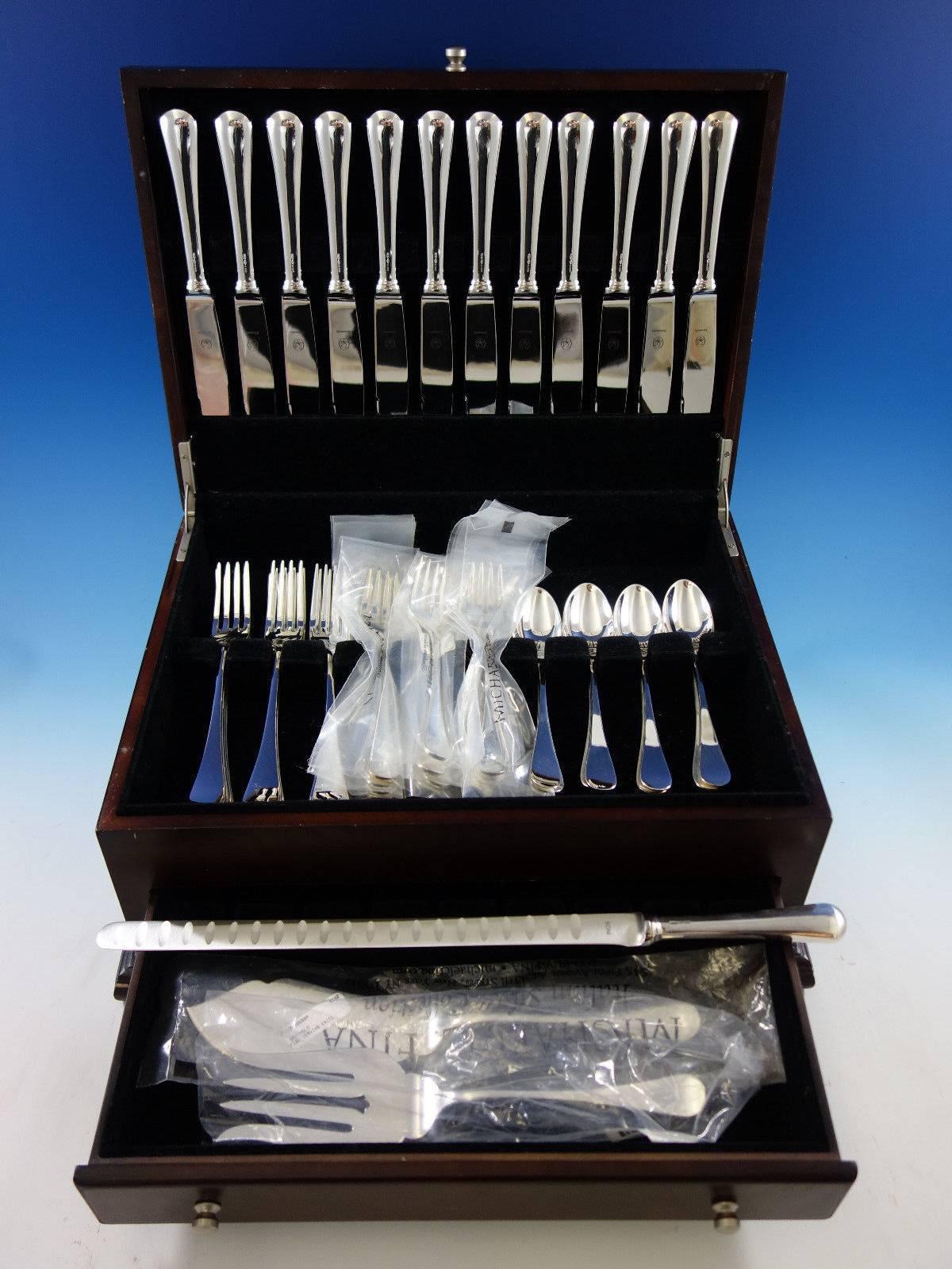Spagnolo by Zarmella Argenti, retailed by Michael C Fina, Italian sterling silver flatware set of 51 pieces. This set is in pristine, unused condition. Note: The teaspoons are Tiffany & Co. King William pattern. This set includes: 

12 dinner size
