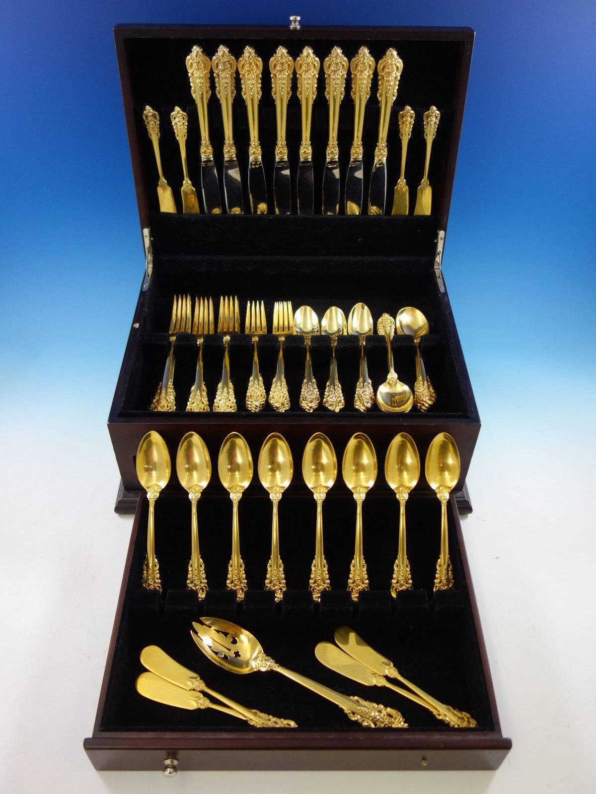 Dinner size golden Grande Baroque Vermeil (completely gold-washed) by Wallace sterling silver flatware set of 57 pieces. This set includes: 

eight dinner knives, 9 3/4
