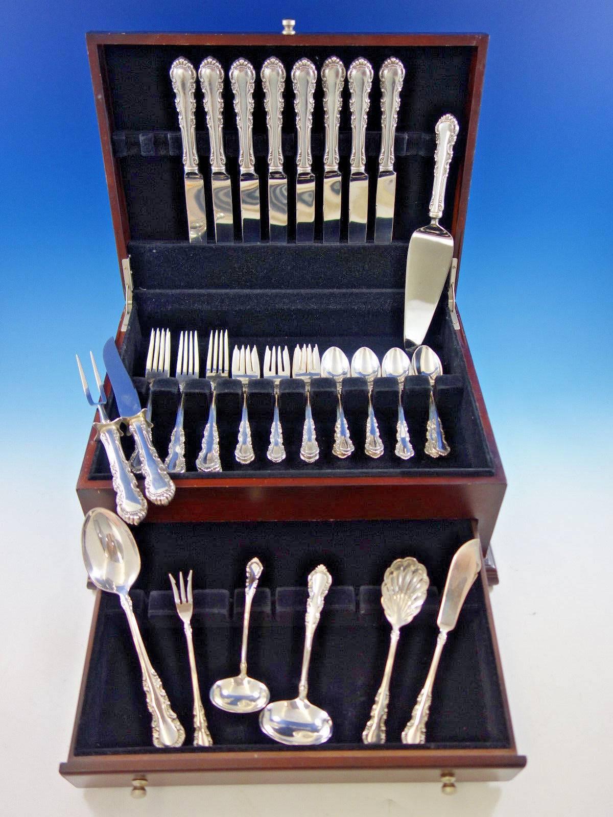 Dinner size Georgian rose by Reed and Barton sterling silver flatware set, 41 pieces. This dinner size set has extra large and impressive forks and knives. This set includes: 

eight dinner size knives, 9 3/4