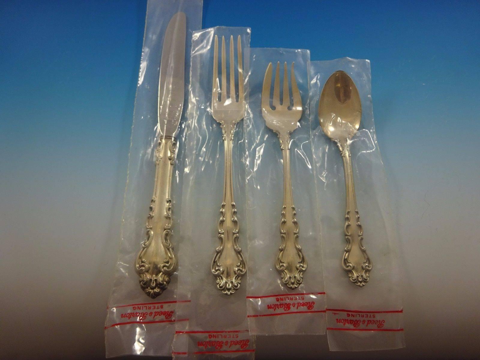 Spanish Baroque by Reed & Barton sterling silver flatware set of 44 pieces. This set includes: 

Eight knives, 9 1/4