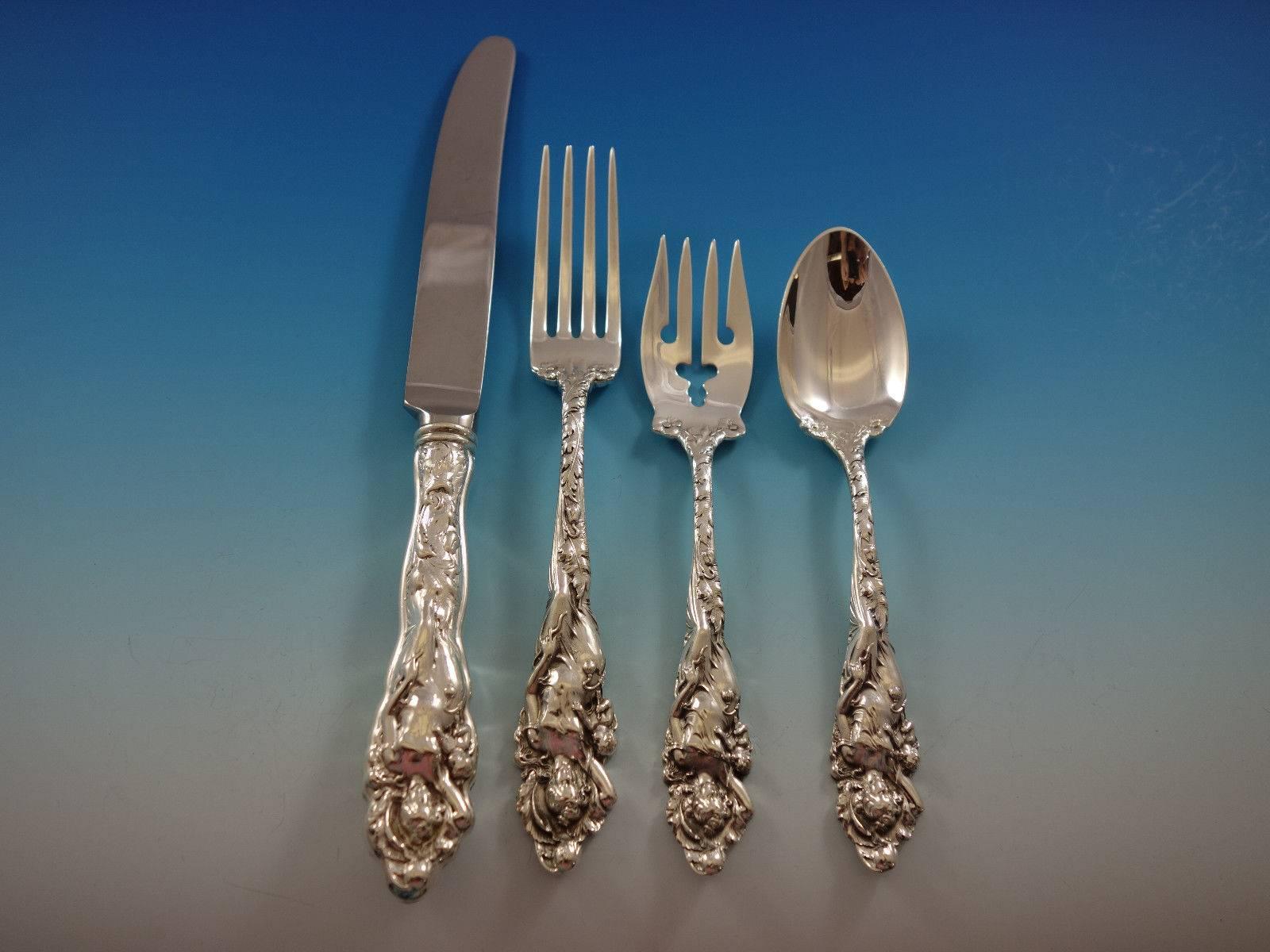 Love Disarmed by Reed and Barton sterling silver flatware set, 67 pieces. This set includes: 12 knives, 9 1/4", 12 forks, 7 1/8", 12 salad forks, 6 1/8",
12 teaspoons, 6", 12 flat handle butter spreaders, 6", two serving