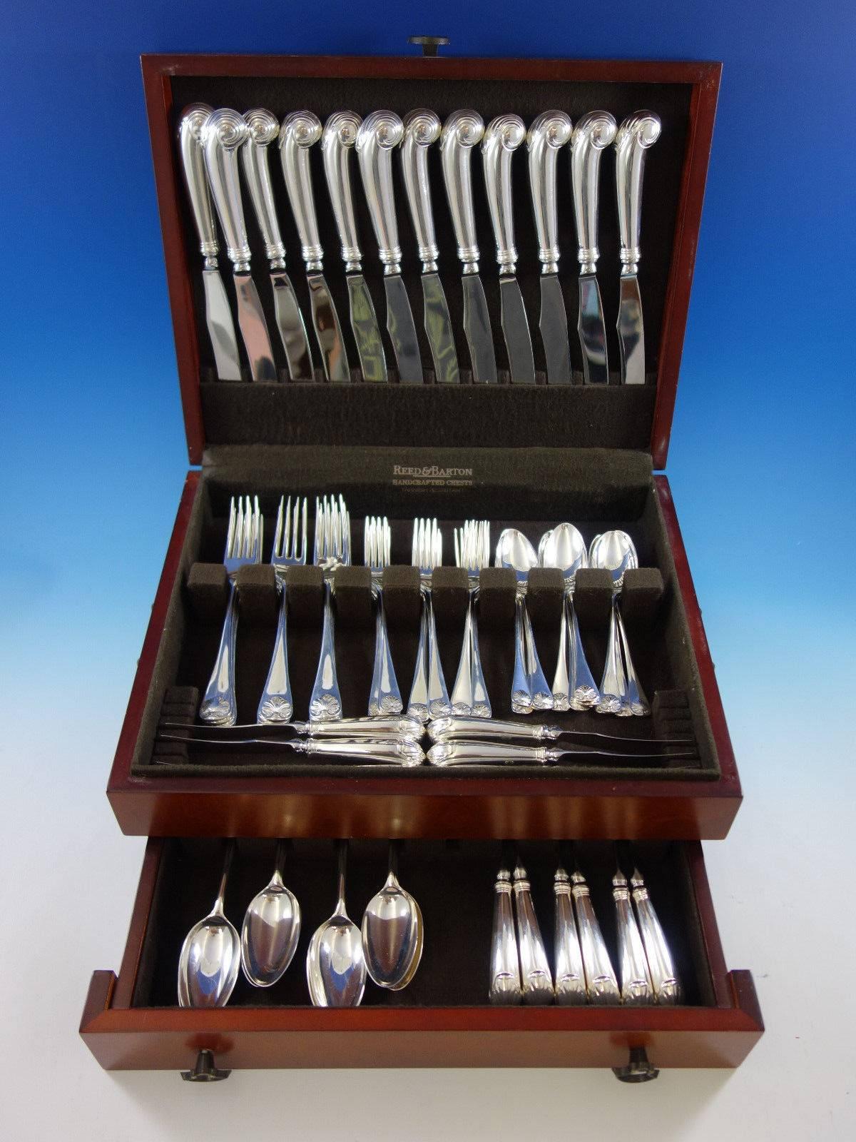 Dinner size Williamsburg Shell by Stieff sterling silver flatware set of 72 pieces. This set includes: 

12 dinner knives with pistol grip handles, 9 3/4