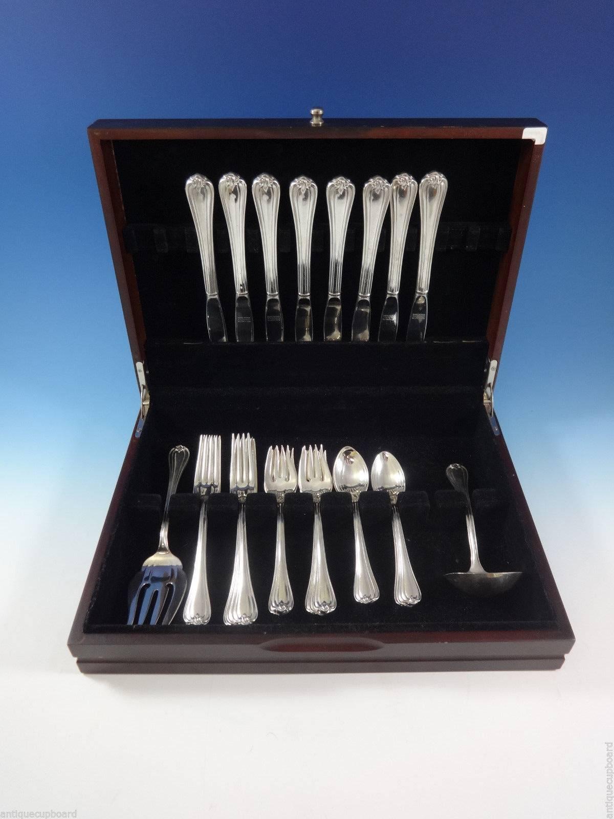 Woodwind by Reed and Barton sterling silver flatware set, 34 pieces. This set includes: 

eight knives, 8 3/4