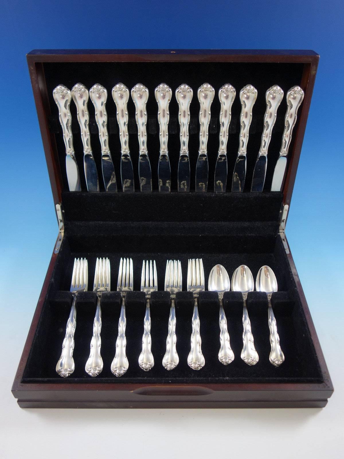 Rondo by Gorham sterling silver flatware set, 48 Pieces. This set includes: 

12 knives, 8 7/8