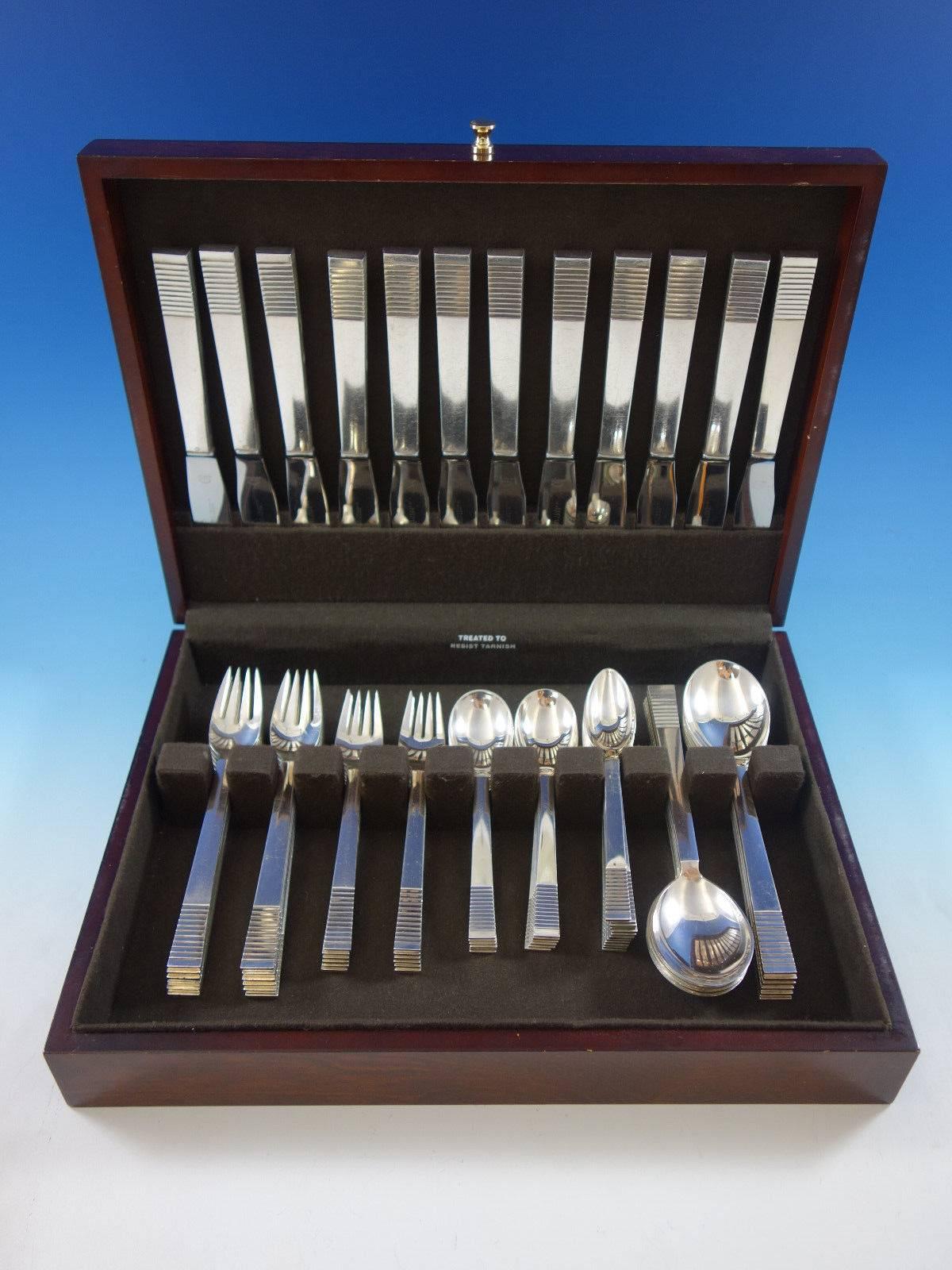 Parallel by Georg Jensen sterling silver flatware set, 72 pieces. This set includes: 12 dinner knives, 8 1/2", 12 dinner forks, 7 1/8", 12 salad forks, 6 1/4", 12 teaspoons, 5 3/4", 12 gumbo soup spoons, 7 1/2", 12 melon