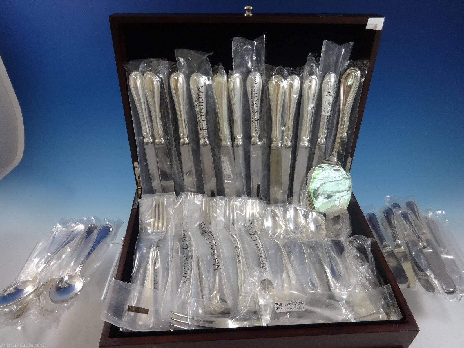 Giorgio by Greggio Italian sterling silver flatware set of 77 pieces. This set is in pristine condition and appears to be unused, with most pieces still in the factory sleeves. This set includes: 

12 large dinner size knives, 10