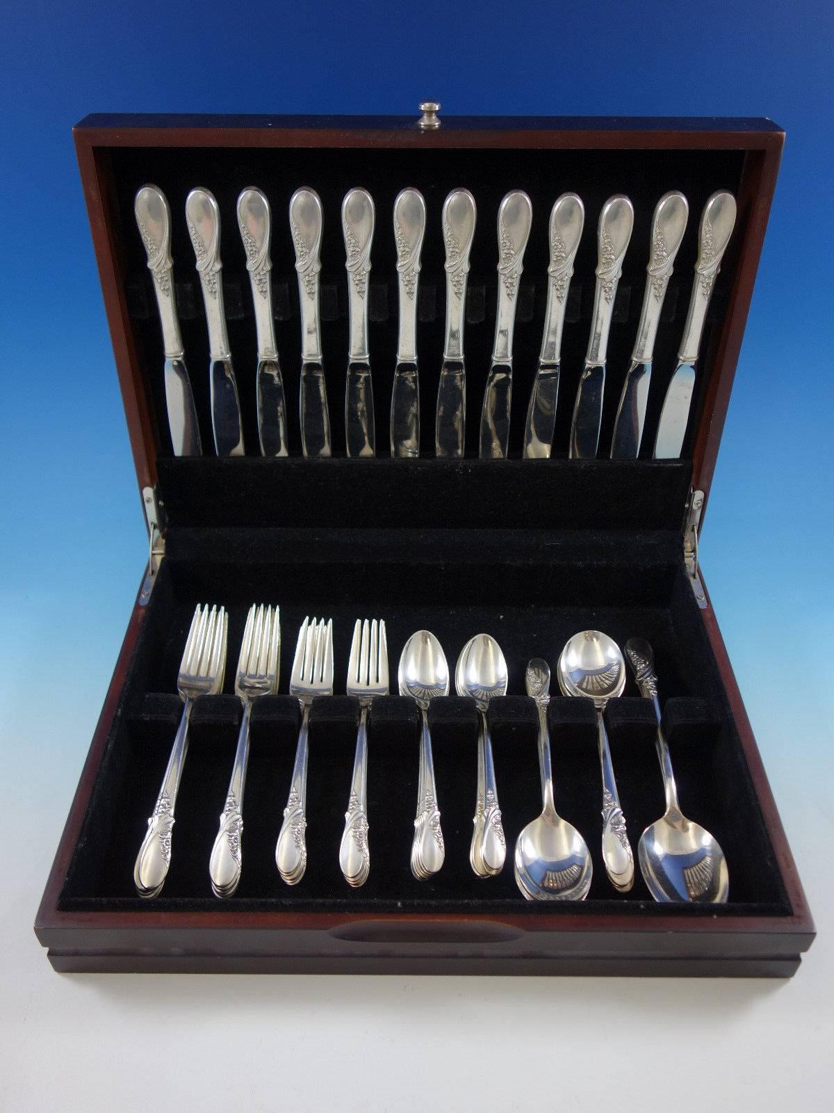 May Melody by International sterling silver flatware set, 62 pieces. This set includes: 

12 knives, 9 1/4