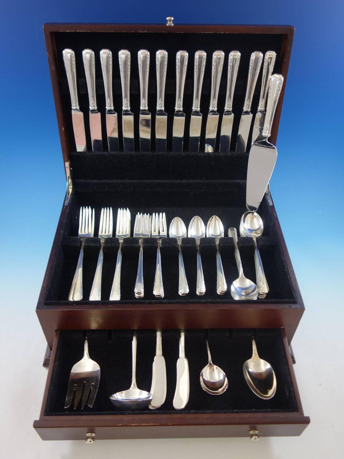 Set di posate in argento sterling Courtship by International da 77 pezzi. Questo set comprende: 

12 coltelli, 9 1/8