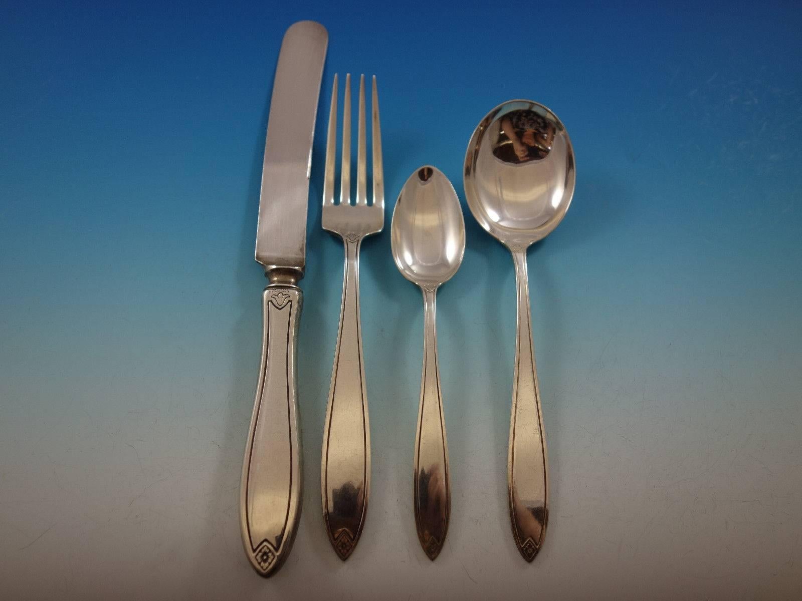 Fiesta by Hallmark sterling silver dinner size flatware set, 26 pieces. This set includes: 

Six dinner size knives, 10