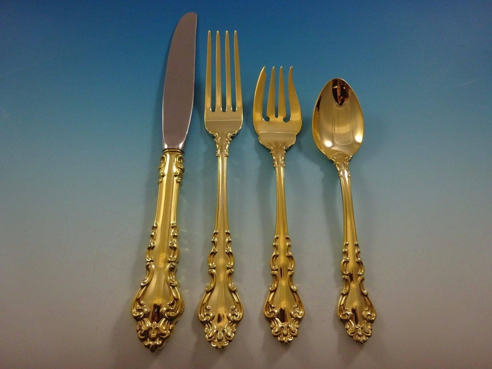 Spanish Baroque gold by Reed & Barton sterling silver flatware set - 32 pieces. This set is vermeil (completely gold-washed) and includes: 

Eight knives, 9 1/8