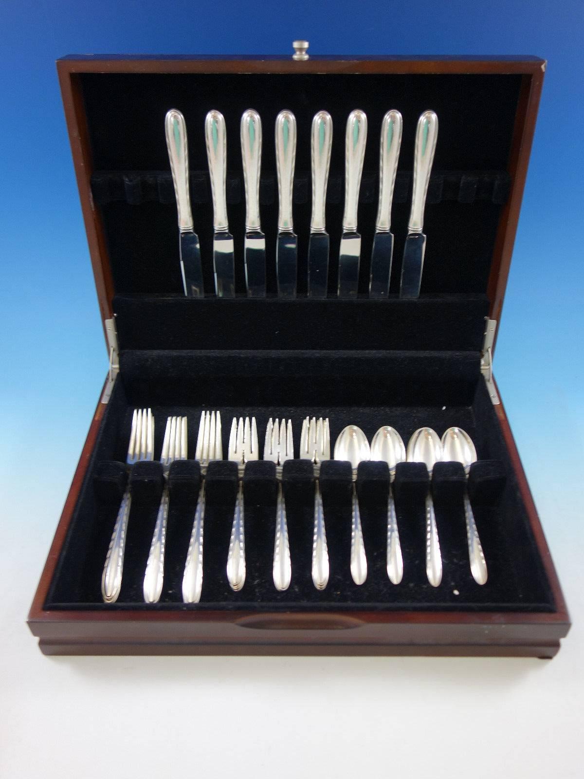 Silver flutes by Towle sterling silver flatware set, 32 pieces. This set includes: 

eight knives, 9