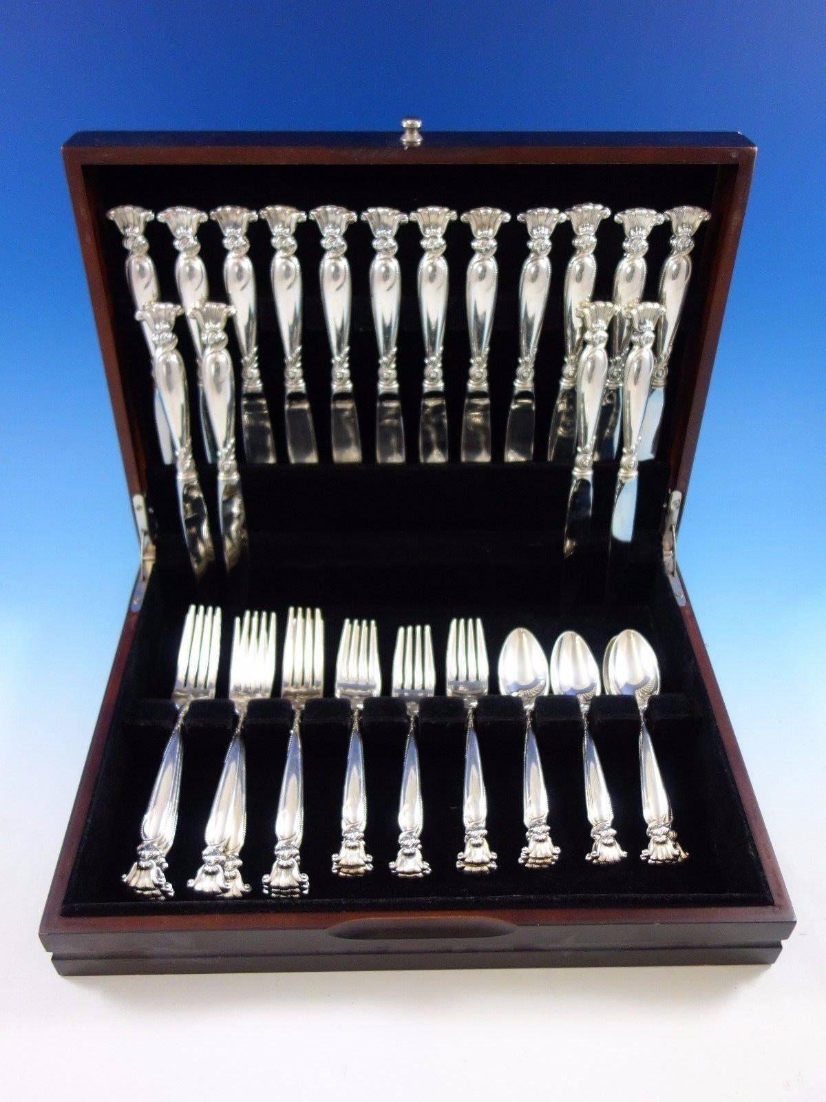 Romance of the sea by Wallace sterling silver flatware set - 40 pieces. This is a great starter set and includes: 

eight knives, 9 1/8