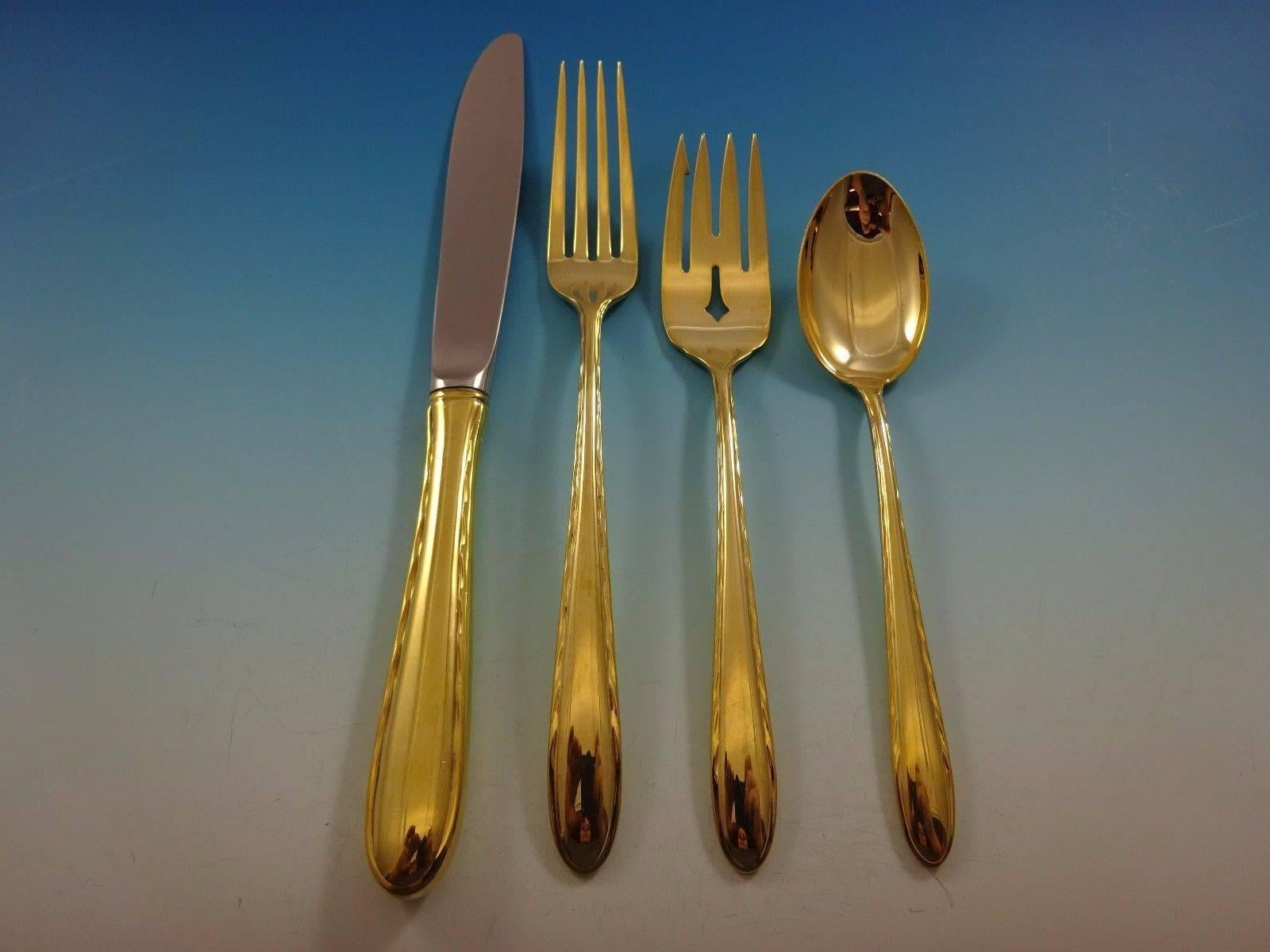Beautiful silver flutes fold by Towle sterling silver flatware set, 32 pieces. This set is vermeil (completely gold-washed) and includes: 

Eight knives, 8 7/8