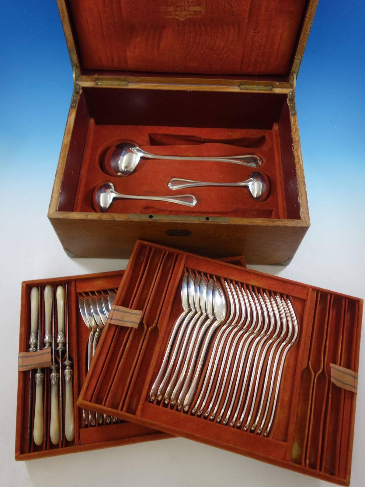 French sterling silver flatware set by Francois Nicoud in Fitted box, circa 1870, 51 pieces. This set includes: 

12 mother-of-pearl handle dinner knives, 10