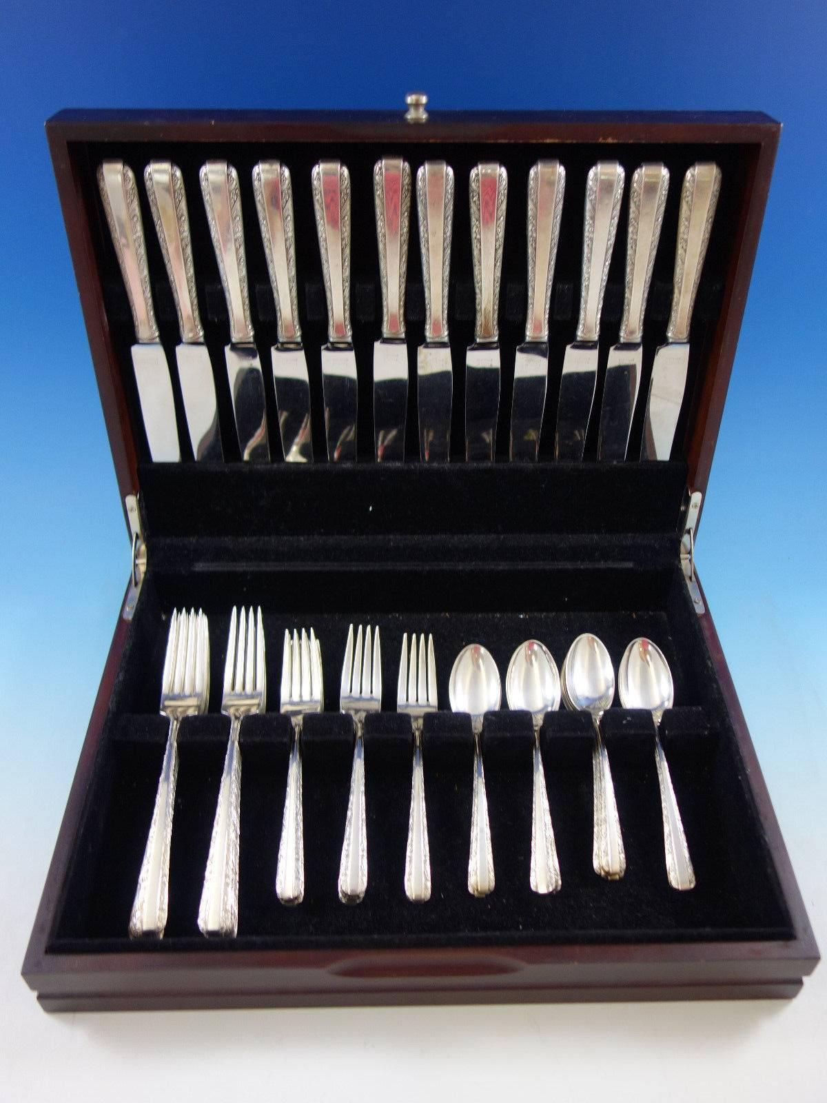 Candlelight by towle sterling silver flatware set, 48 pieces. This set includes: 

12 dinner size knives, 9 5/8