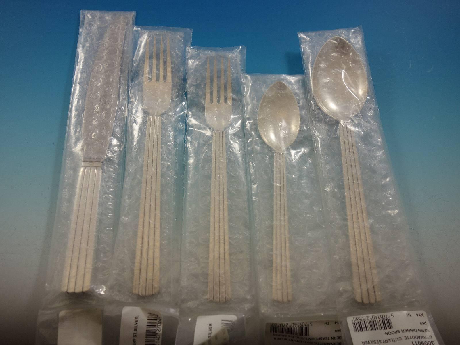 New in factory sleeves Bernadotte by George Jensen sterling silver flatware set of 63 pieces. This set includes: 12 dinner knives, short handle, 8 3/4