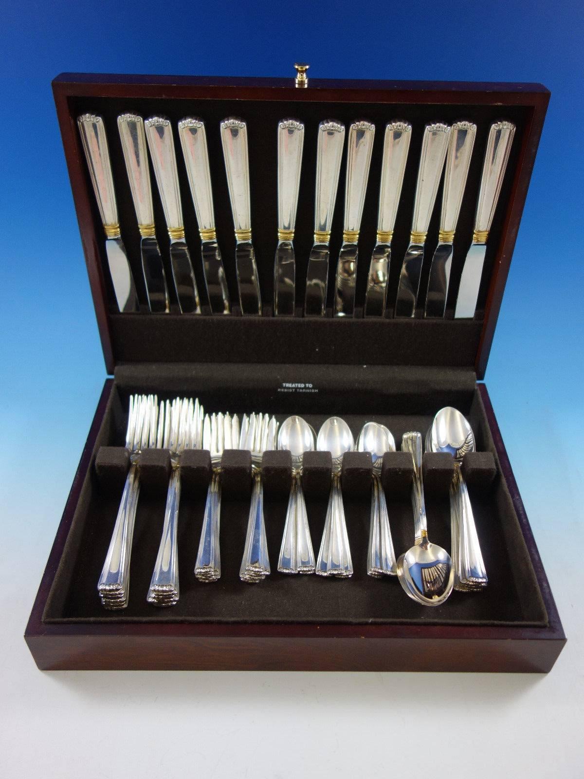 Embassy Scroll Gold by Lunt sterling silver flatware set of 60 pieces. This set includes: 

12 dinner size knives, 9 1/4